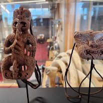 20250503_160719 Traditional Māori carvings, a tekoteko, which is a stylized representation of a tribal ancestor and a focal point in a whare whakairo (carved tribal meeting...