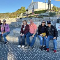 IMG-20250503-WA0008 Near the geothermal area were some stone carved seats that are warmed by the activity below them. Here some of our tour group took a moment to rest and warm...