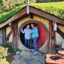 20250504_103507 Sharon and Ken welcome you to one of the Hobbit holes. Our tour guide explained that they used different scales for filming, in order to create perspective...