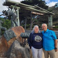 20250411_103231 Sharon and Ken at the Memorial Arch at Eastern View of the Great Ocean Road. This wooden arch and statue commemorates the work of returned WWI soldiers who...