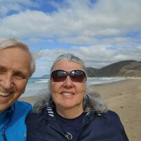 20250411_103737 Ken and Sharon on the beach at the Memorial Arch on the Great Ocean Road.