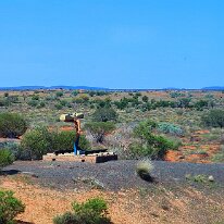 20250417_111255 After passing the Finke River, The Iron Man is a unique monument marking the site of the one-millionth concrete sleeper laid on the stretch of railway line...