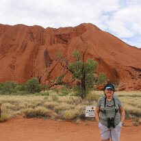 IMG_2221 Sharon braves a moment without the fly net in front of a corner of Uluru.