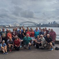IMG-20250505-WA0005 Here is our tour group at Mrs Macquarie's Point with our tour guide Ronan up front and center.