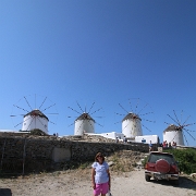 IMG_1802 Sharon in front of the Chora, Mykonos windmills. The windmills are the first thing seen when coming into the harbour of Alefkandra, as they stand on a hill...