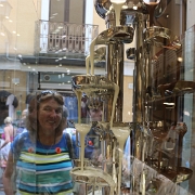 IMG_1866 The chocolate found while shopping the streets of Sorrento was exquisite. Here Sharon observes a chocolate fountain in the window of a shop. One side was milk...