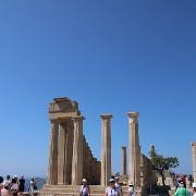 IMG_1579 Sharon in front of the Doric Temple of Athena Lindia, a tetrastyle amphiprostyle edifice (having a stoa with four columns at either end). It consists of a...