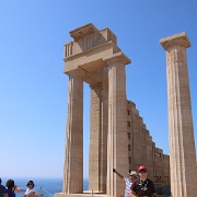 IMG_1580 Kris in front of the Temple of Athena Lindia. Inside the temple is the table of offerings and the base of the cult statue of Athena. The temple was built of...